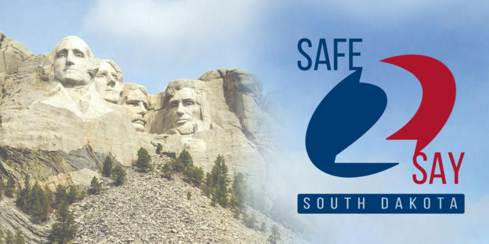 The Safe2Say South Dakota logo on a blue-sky background beside Mt. Rushmore